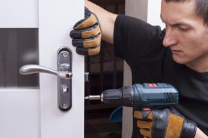 Commercial locksmith working on advanced security system setup