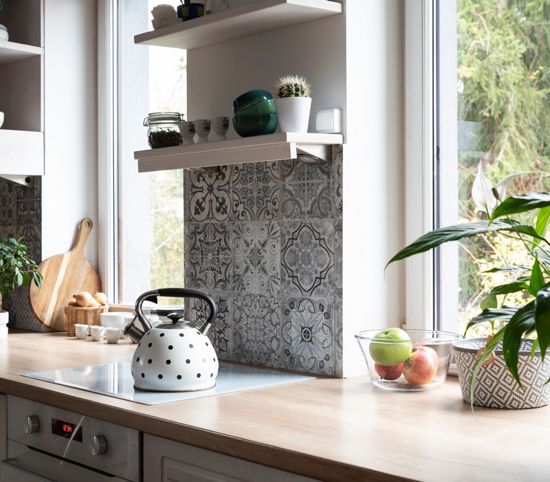 Charcoal gray kitchen cabinets for a sleek modern look in Austin